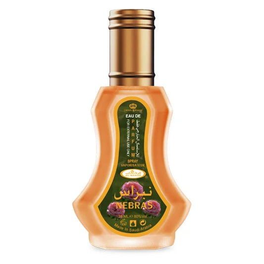 Peachkleurige Al-Rehab parfum Nebras met gouden dop, ideaal voor parfum Nebras fans