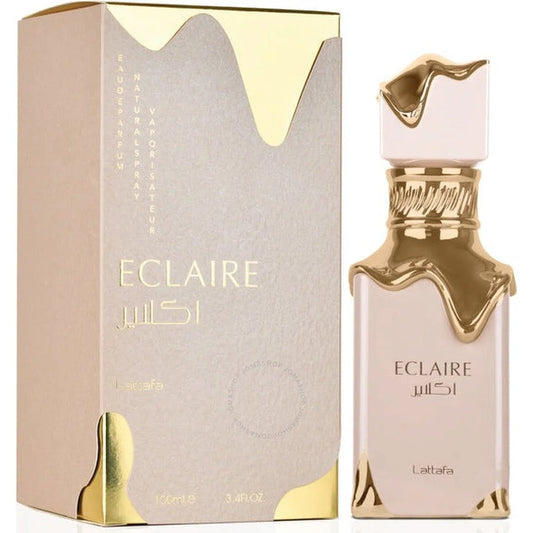 Eclaire Lattafa Arabische parfum met witte bloemen en gouden details in een lichtkleurige fles