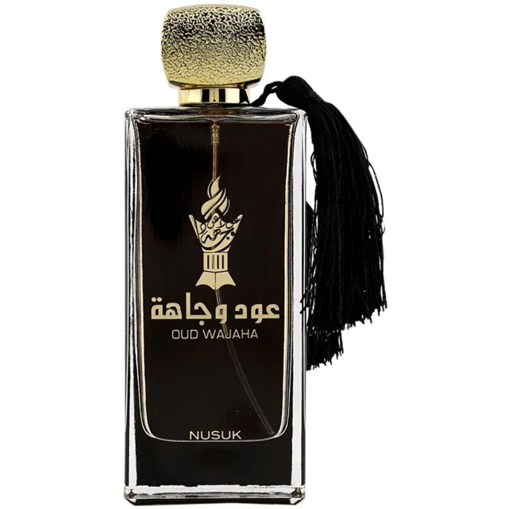 Zwarte glazen parfumfles met gouden dop, tassel en Oud Wajaha etiket